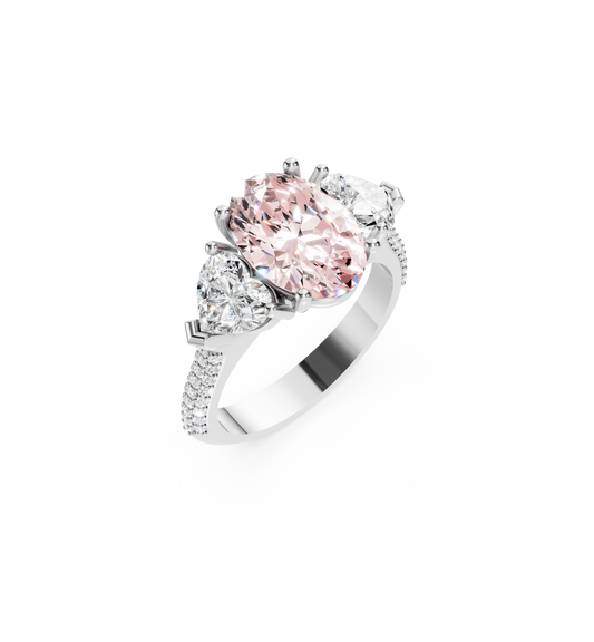 Bespoke 2.01ct oval lab-grown fancy intense pink diamond trilogy engagement ring with heart-cut diamond side stones on a tapered pavé 18K white gold band
