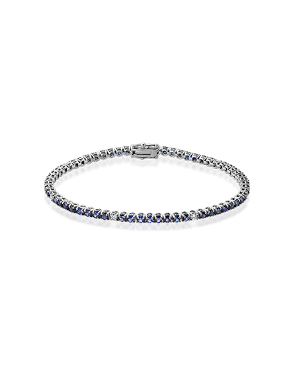 White gold tennis bracelet, set with blue sapphires and diamonds