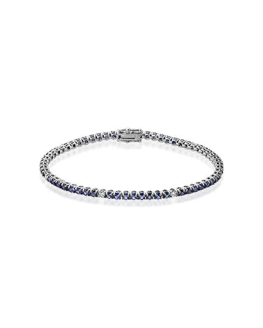 White gold tennis bracelet, set with blue sapphires and diamonds